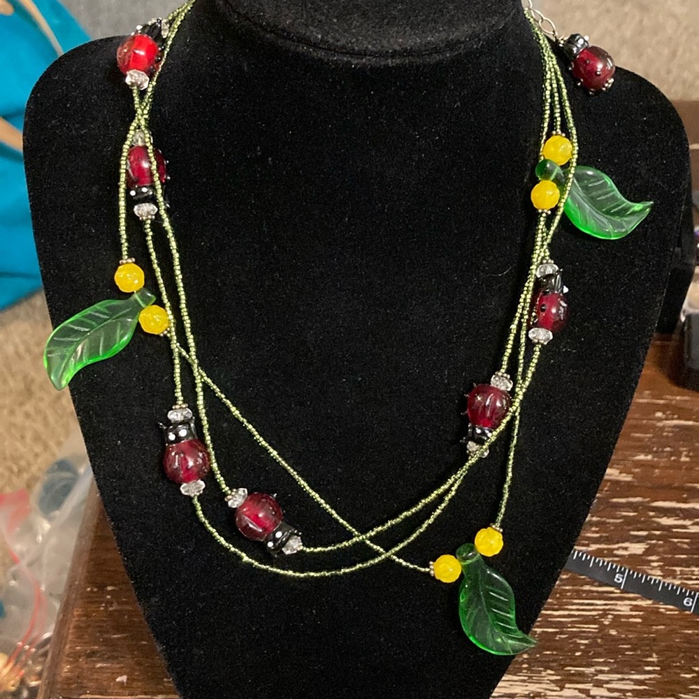 Adorable glass lady bug and leaf necklace on 925 clasps